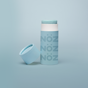 A blue bottle of our affordable, eco-friendly, and vegan Noz Sunscreen with our logo on the bottle.